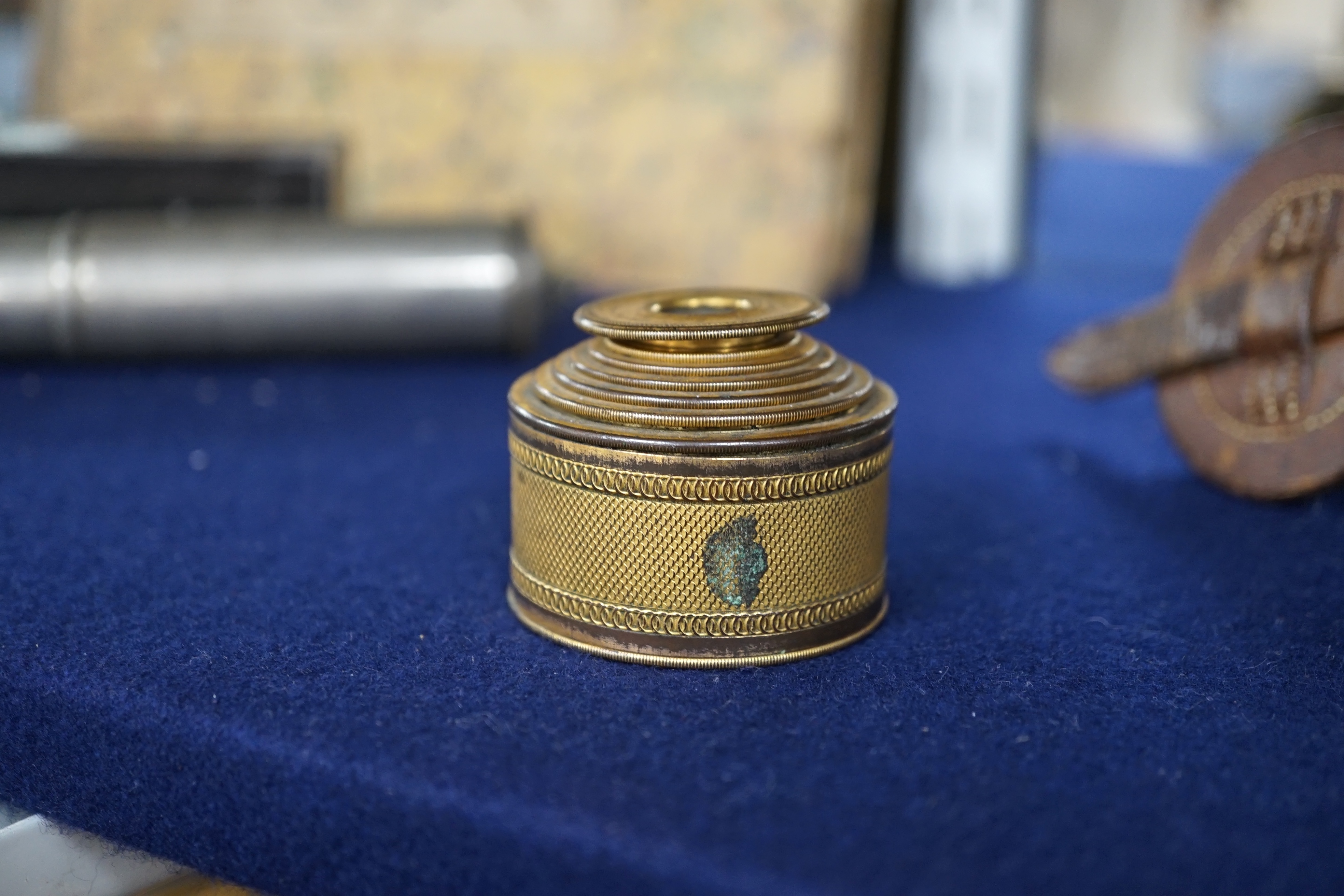 A 19th century gilt brass six drawer monocular telescope by Dollond, London, 10cm fully extended. Condition - fair, some wear to gilt finish.